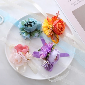 Set of four handmade floral wrist corsages in blue, orange, pink and purple silk petals