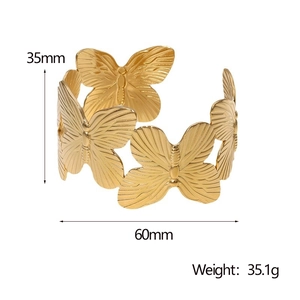 Detail showing 35mm height and 60mm diameter of the gold butterfly cuff bracelet