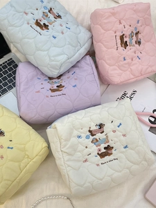 Pastel quilted cosmetic bags with heart texture and sausage dog embroidery for travel