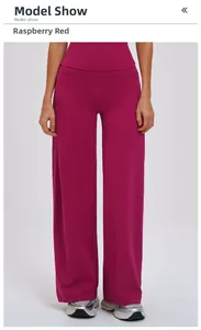Close-up of raspberry red high-waisted yoga pants showing premium elastic fabric texture