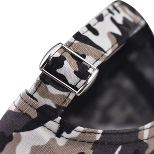 Macro view of adjustable metal buckle and camouflage cotton fabric on the baseball cap