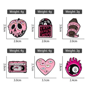 Creative pink gothic enamel pins set featuring skull masks and heart shaped metal badges