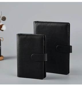 Detailed view of two black premium faux leather A5 and A6 binders with metal buckles