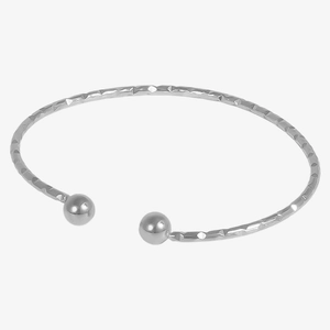 Detailed view of silver stainless steel open bangle with faceted texture and round beads