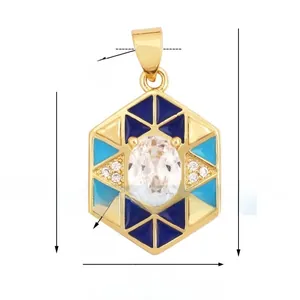 Macro detail of gold hexagon pendant with blue enamel and oval centerpiece crystal