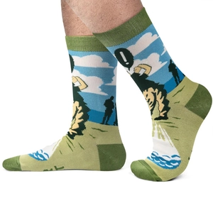 Detailed view of green and blue mid-calf socks with pixelated lion and human illustration