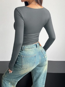 Back view of a grey square neck long sleeve top with a slim fit and elastic fabric