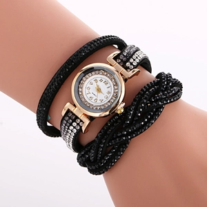 Elegant gold rhinestones watch with black multi-wrap bracelet strap on female wrist
