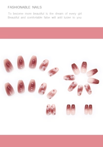 Detail of gradient pink press-on nails with white camellia and glitter accents