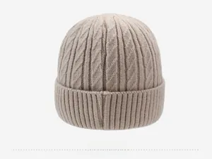 Detailed back view of light beige cable knit beanie with ribbed cuff for winter warmth