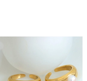 Detail of 18k gold plated open rings featuring one minimalist and one pearl accent band