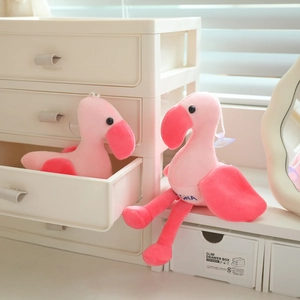Detailed macro view of soft pink flamingo plush keychain with a handy suction cup