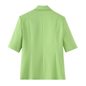 Detail view of the back of a light green short sleeve blazer with slim fit tailoring