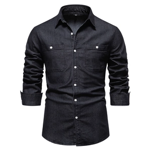 Detail of grey denim shirt fabric texture with classic chest pockets and stitching