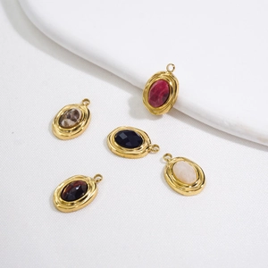 Detail of five oval natural stone pendants in vintage gold settings for DIY jewelry