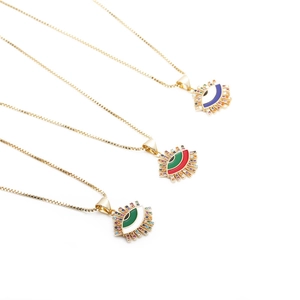 Three gold necklaces with colorful evil eye pendants on a clean white background