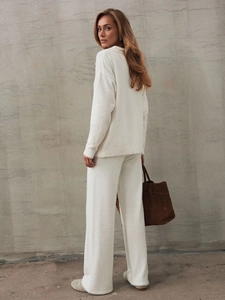 Women's ivory plush knit two-piece set featuring long-sleeved top and wide-leg pants