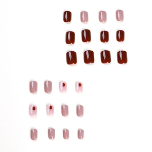 Short square press-on nails featuring burgundy red and cherry graffiti designs