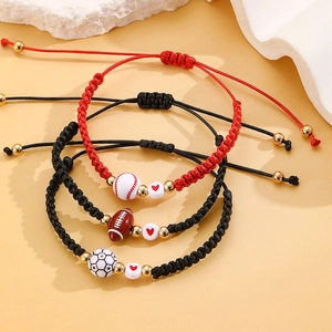 Detailed view of adjustable sports woven bracelets with baseball and football beads