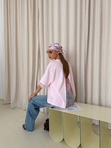Pink short sleeve T-shirt featuring elegant white lace back and stylish back slit detail