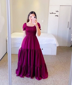 Detail of smocked chest and tiered long skirt on purple floral off-shoulder dress