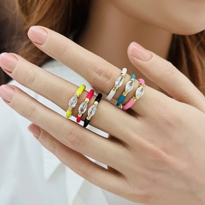 Close-up of colorful enamel water drop rings with micro-set zircon on model's hand