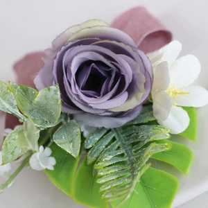 Elegant lilac silk rose wedding boutonniere with greenery for grooms and guests