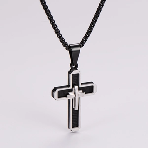 Detail of multi-layer cross pendant with Spanish Lord's Prayer engraving on box chain