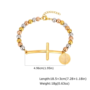 Detailed view of tricolor beaded bracelet with a gold cross and Saint Benedict medal charm