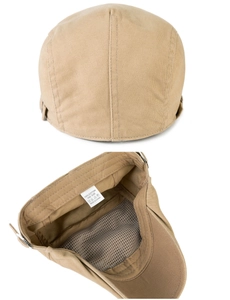 Detail van beige katoenen pet met ademende mesh voering en verstelbare metalen gesp