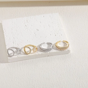 Minimalist pearl and zircon rings in gold and silver finish with geometric hollow design