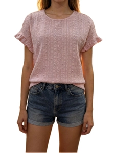 Close-up of pink hollow-out knit t-shirt with ruffle cuffs and geometric textures