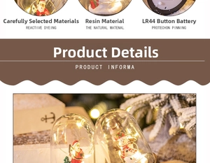 Detail of Christmas lantern with resin Santa and snowman figurines and LR44 LED battery info