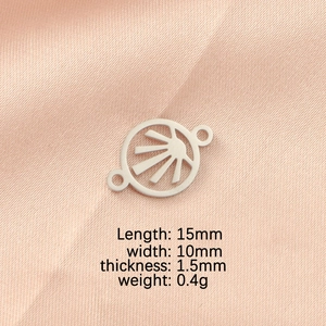Detailed view of silver sunburst charm on pink silk with 15x10mm size specifications