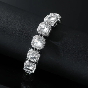 Hip hop iced out silver square rhinestone Cuban bracelet on a black display base
