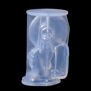 Macro view of a translucent silicone astronaut ice mold with a cylindrical outer shell