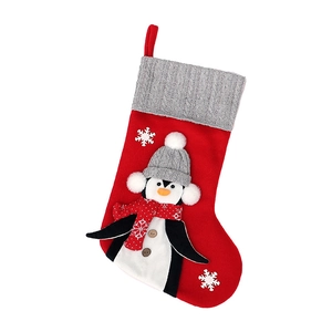 Christmas stocking with 3D penguin character and knit cuff for holiday gifts and decoration