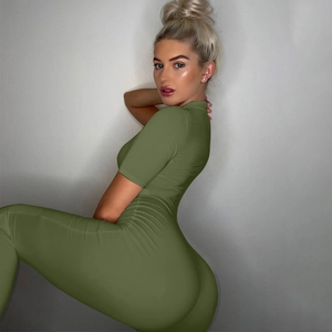 Slim fit army green short sleeve jumpsuit showing elastic knit material and bodycon silhouette