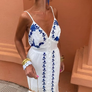 White sexy deep V-neck maxi dress with blue floral embroidery and mirror details