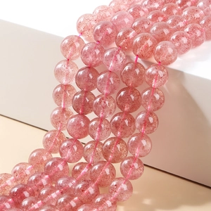 Macro shot of natural pink strawberry quartz round beads for DIY jewelry making and crafts