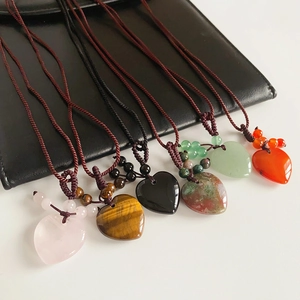Detailed collection of heart-shaped gemstone pendants with hand-woven cord necklaces