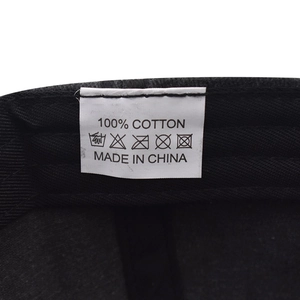 Close-up of the cotton label inside the USA baseball cap showing washing instructions