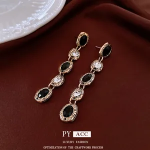 Vintage baroque drop earrings with black and white zircon gems on gold alloy base