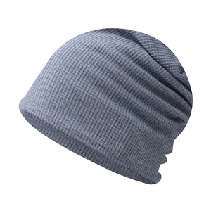 Detailed close-up of grey waffle knit beanie showing textured fabric and slouchy design