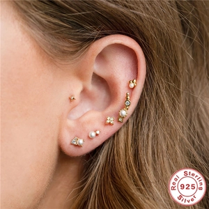 S925 sterling silver gold stud earring set with pearls and zircons on model ear
