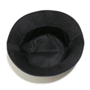 Overhead view of a black bucket hat showing interior structure and stitched brim detail