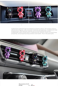 Car air vent clip freshener featuring cartoon astronaut design in four vibrant colors
