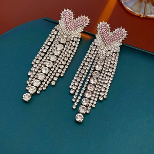 Detail of pink heart stud earrings with sparkling silver rhinestone fringe tassels