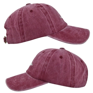 Detailed side view of washed cotton baseball cap with small shark embroidery and metal buckle