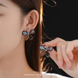 Exquisite floral stud earrings with multi-colored crystals and silver needles for women